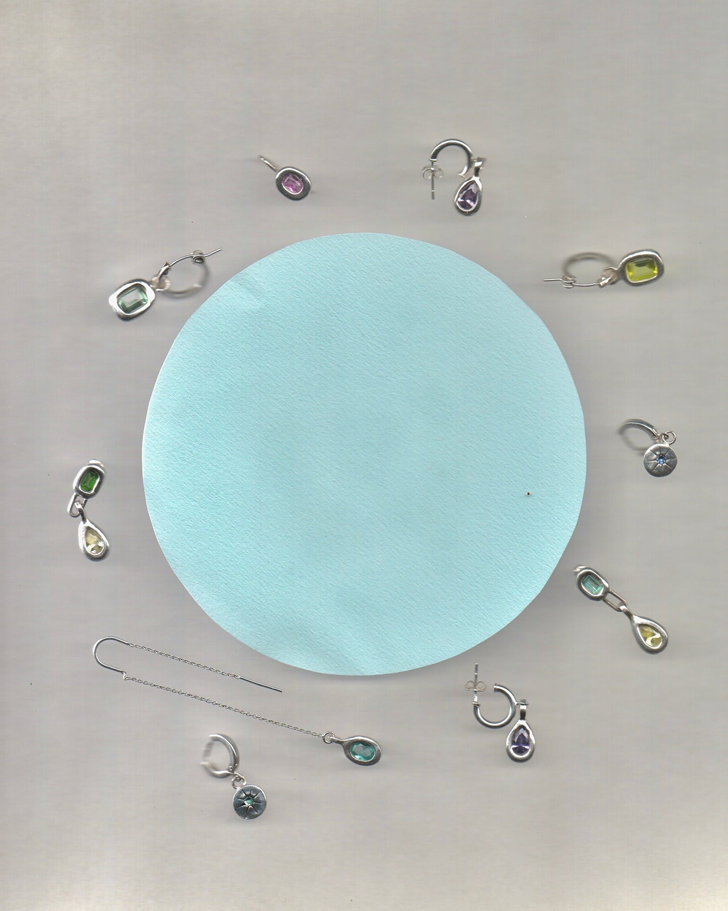 Mismatched dangling earrings
