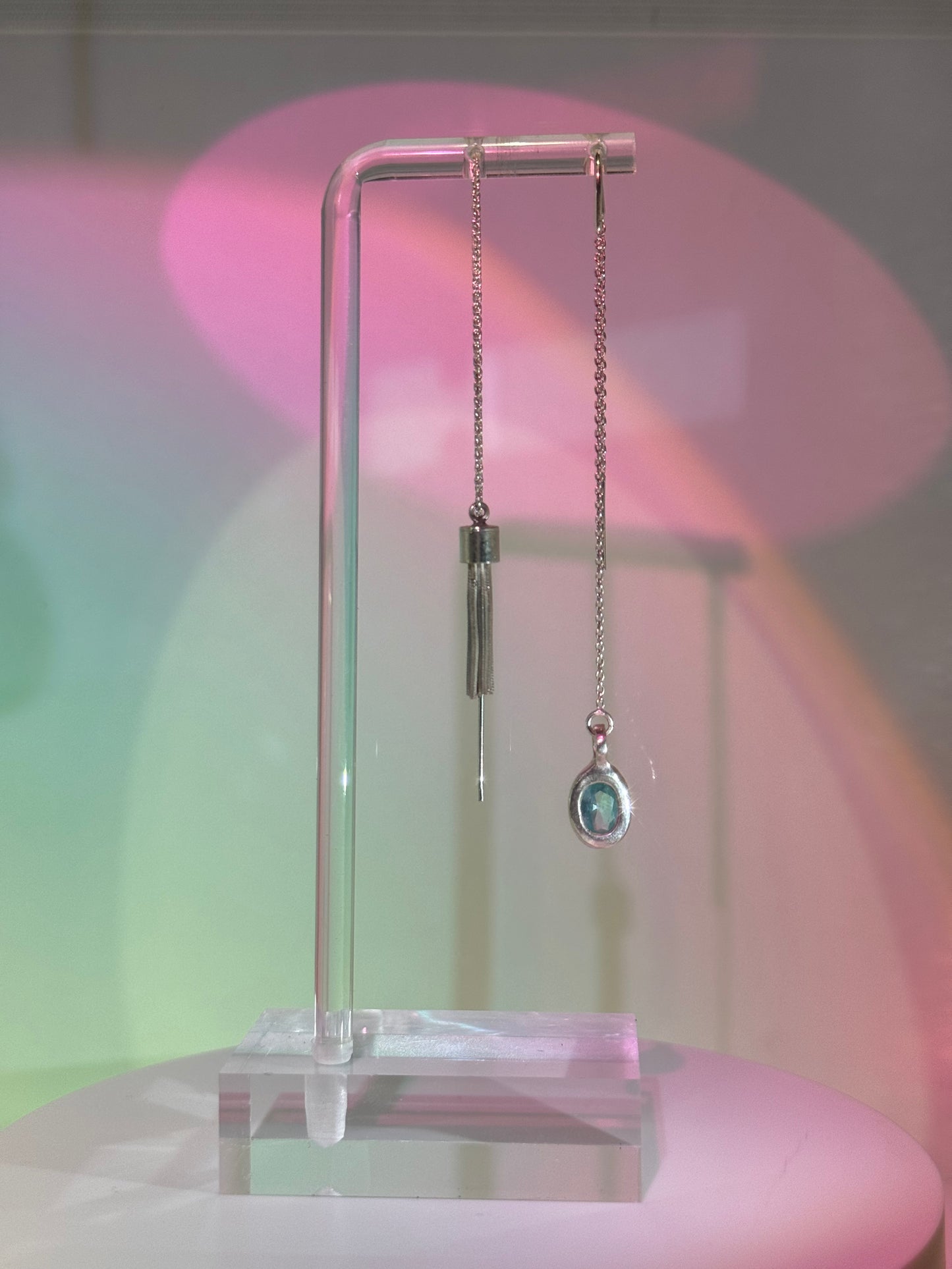 Mismatched dangling earrings