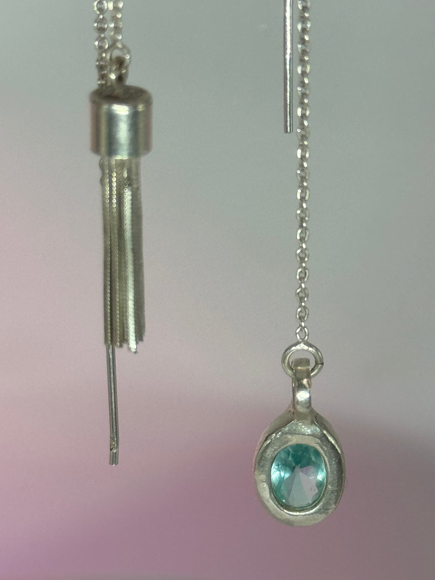 Mismatched dangling earrings