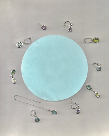 Mismatched dangling earrings