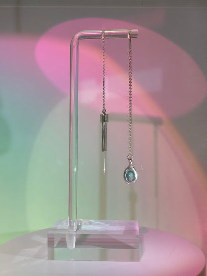 Mismatched dangling earrings