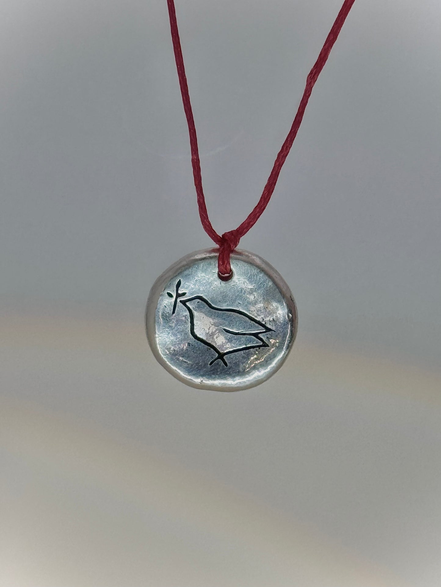 Pigeon & twig pendant